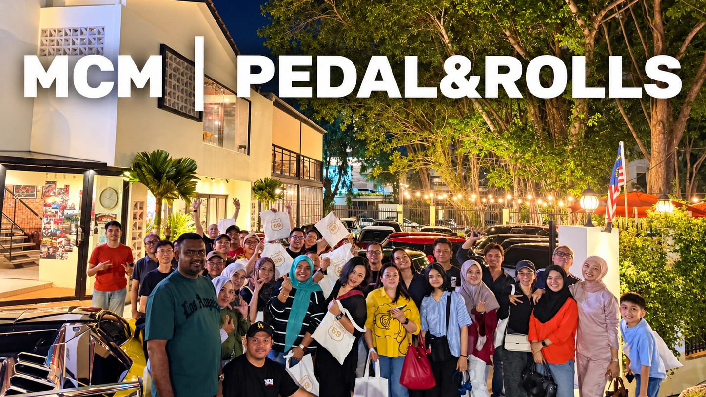 MCM guests gathered with cars outside Pedal & Rolls at night